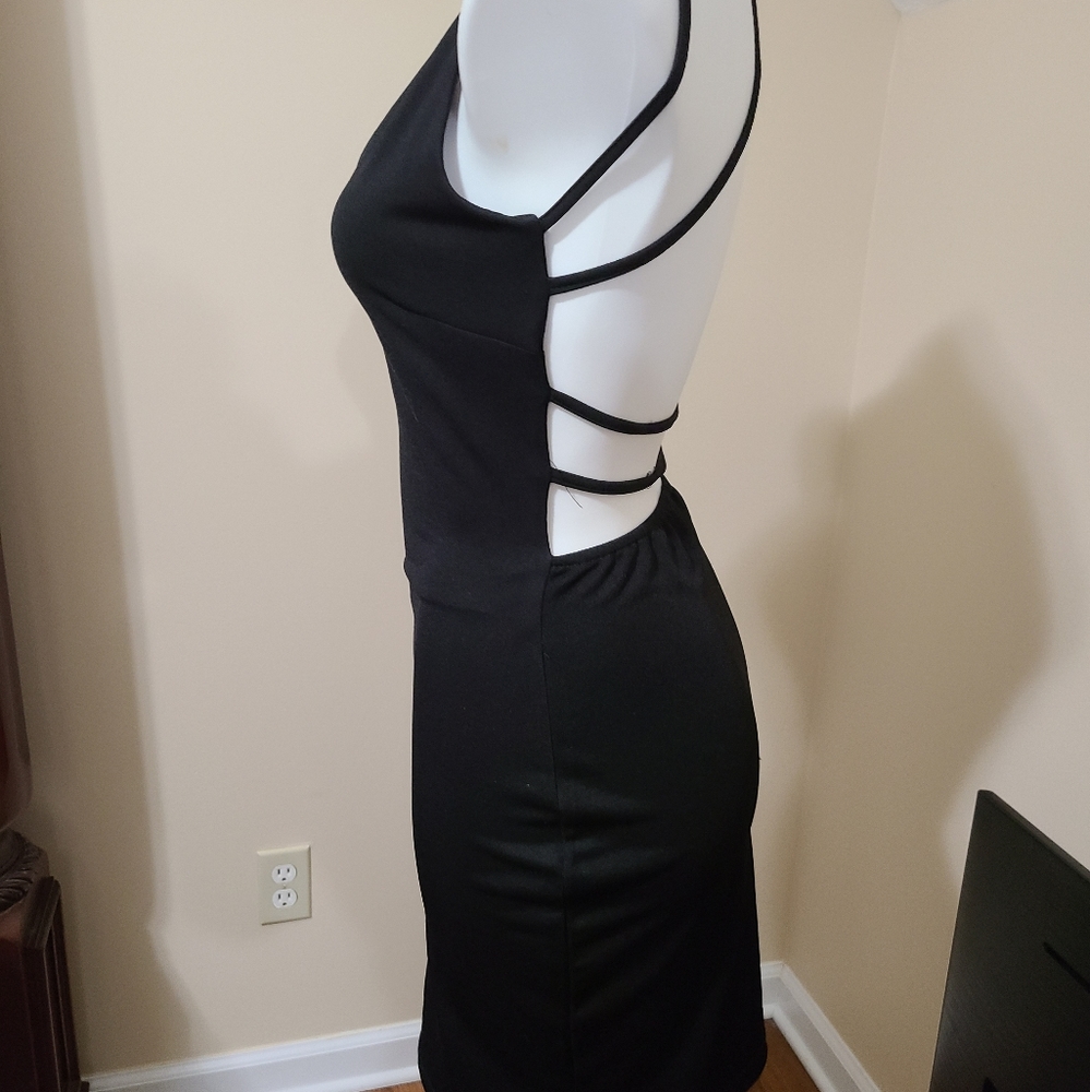 Strappy backless black dress. Fits size 4-6